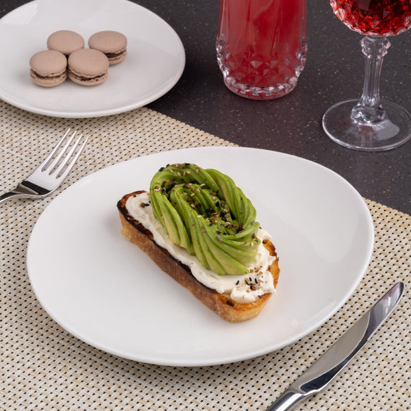 Ariane 10 5/8" Vital Coupe - Warm White Porcelain Coupe Elevated Plate - 12/Case (AVCARN000111027) - iFoodservice Online