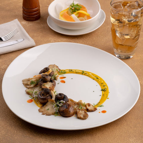 Ariane 12 1/5" Vital Coupe - Warm White Porcelain Elevated Plate - 6/Case (AVCARN000111031) - iFoodservice Online