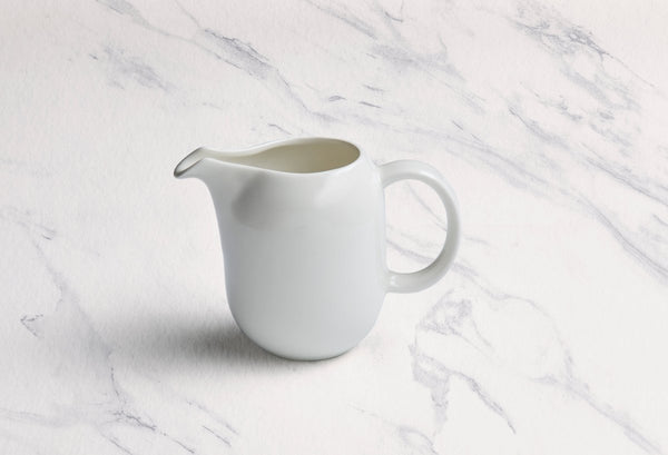 Ariane 8 4/9 Oz Vital Coupe - Warm White Porcelain Creamer With Handle - 6/Case (AVCARN000064025) - iFoodservice Online