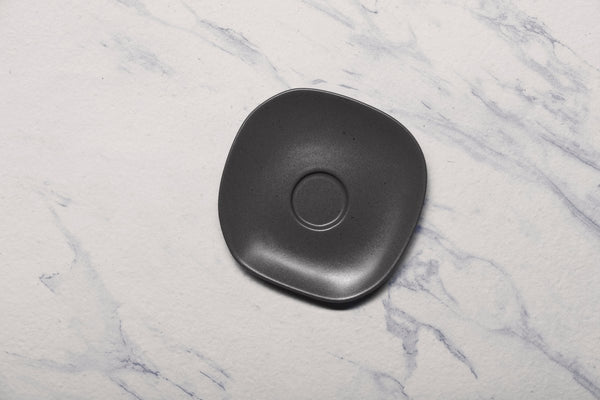 Ariane Earth 6" Earth - Charcoal Black Porcelain Saucer - 12/Case (AERARN510014015) - iFoodservice Online