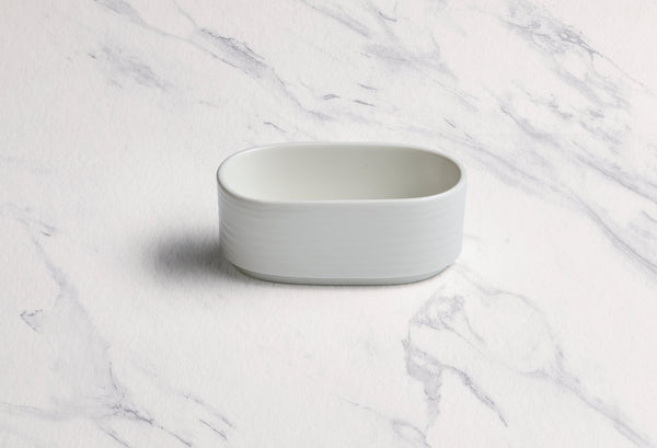 Ariane Prime 4 1/3" White Eclipse Porcelain Sugar Pack Holder - 12/Case (APRARN120077002) - iFoodservice Online