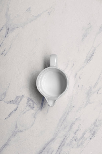 Ariane Prime 5 Oz White Eclipse Porcelain Creamer With Handle - 12/Case (APRARN120064015) - iFoodservice Online