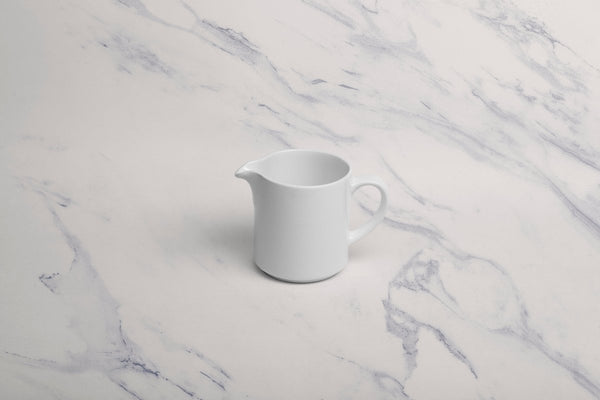 Ariane Prime 8 4/9 Oz Orba White Porcelain Creamer With Handle - 12/Case (APRARN121064025) - iFoodservice Online