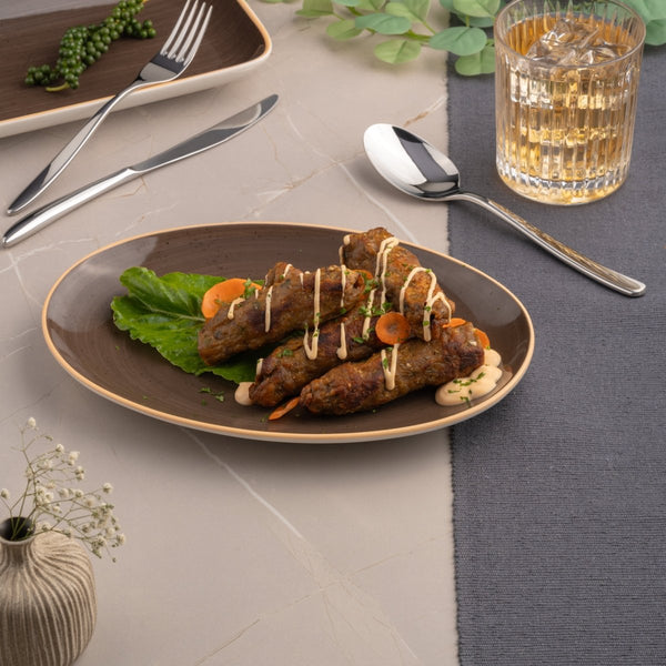 Ariane Vital Coupe 10 1/4" Twister Deep Brown Porcelain Coupe Oval Plate - 12/Case (AVCARN263015026) - iFoodservice Online