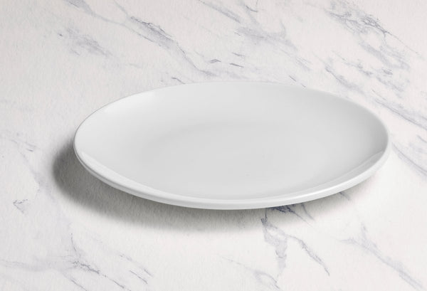 Ariane Vital Coupe 10" Vital Coupe - Warm White Porcelain Coupe Round Rimless Plate - 6/Case (AVCARN000011025) - iFoodservice Online