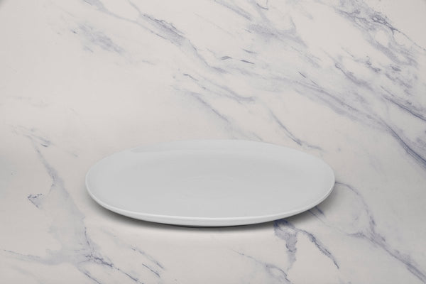 Ariane Vital Coupe 12 3/5" Vital Coupe - Warm White Porcelain Coupe Oval Plate - 6/Case (AVCARN000015032) - iFoodservice Online
