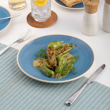 Ariane Vital Coupe 8 1/4" Twister Blue Porcelain Coupe Round Rimless Plate - 12/Case (AVCARN264011021) - iFoodservice Online