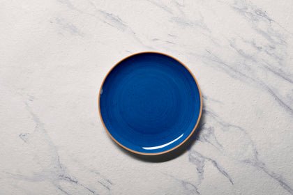 Ariane Vital Coupe 8 1/4" Twister Blue Porcelain Coupe Round Rimless Plate - 12/Case (AVCARN264011021) - iFoodservice Online