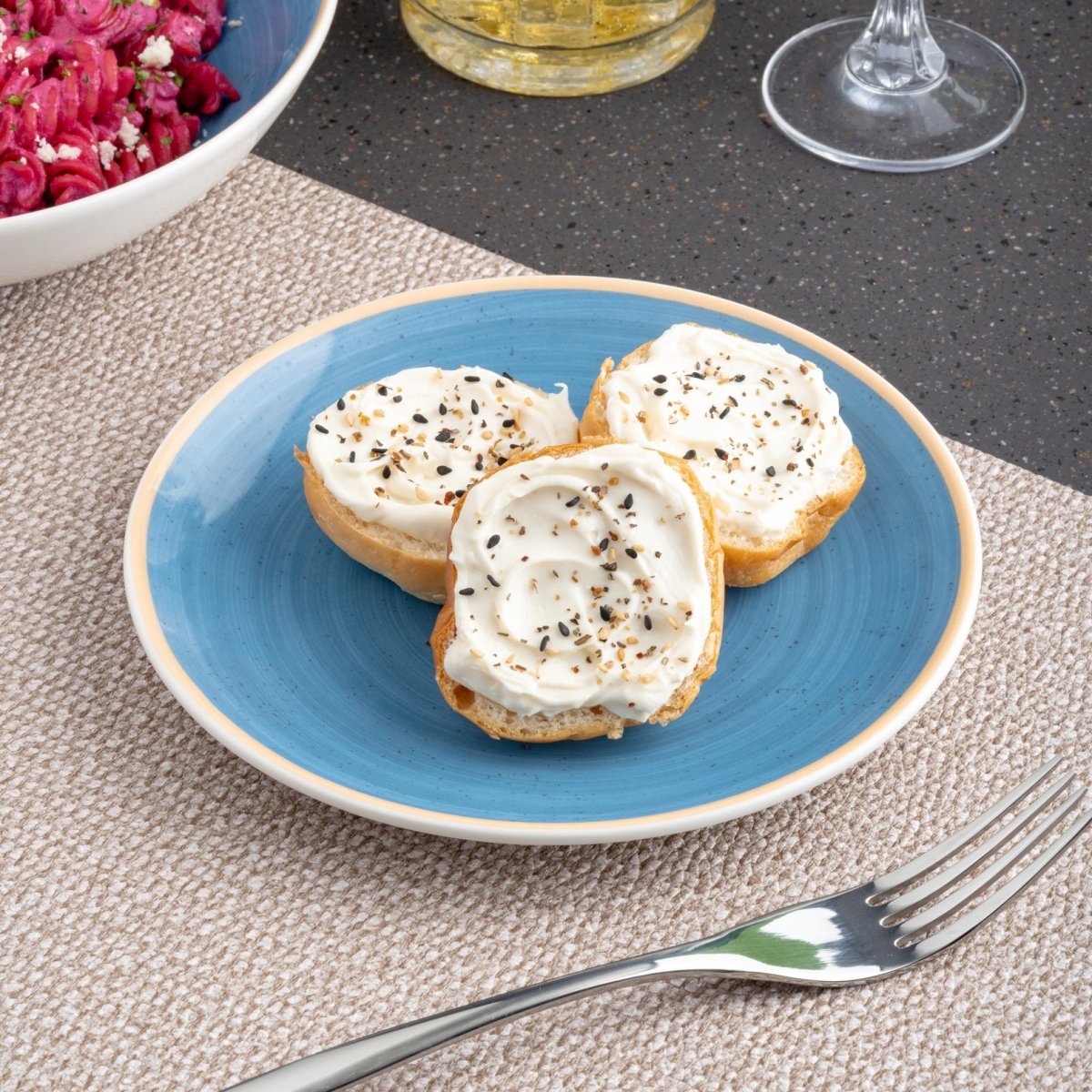 Ariane Vital Coupe 9 4/9" Twister Blue Porcelain Coupe Round Rimless Plate - 6/Case (AVCARN264011024) - iFoodservice Online