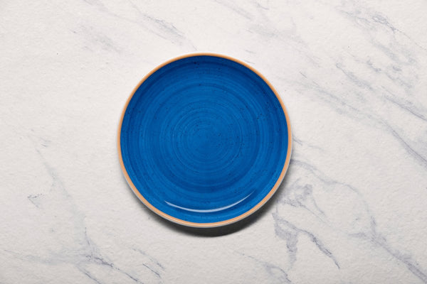 Ariane Vital Coupe 9 4/9" Twister Blue Porcelain Coupe Round Rimless Plate - 6/Case (AVCARN264011024) - iFoodservice Online