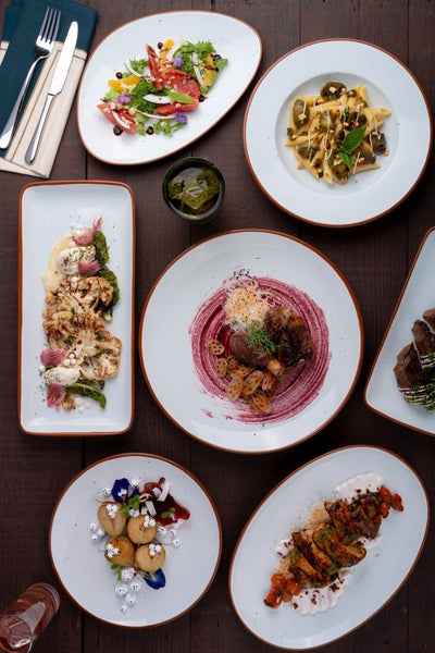 Ariane Vital Coupe White 8 1/4" Terra Arena Porcelain Coupe Round Rimless Plate - 12/Case (AVCARN205011021) - iFoodservice Online